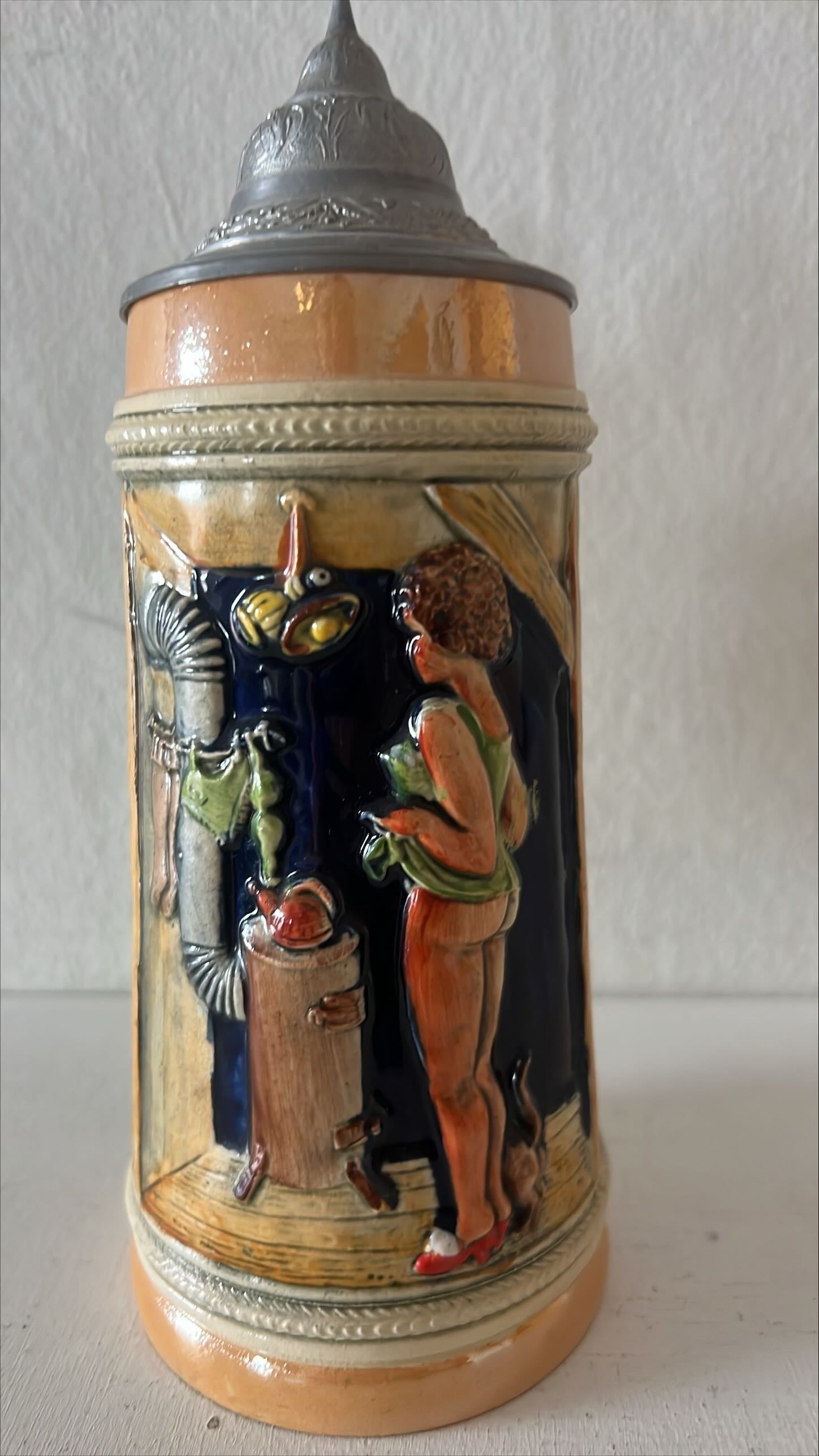 Home, Kitchenware, Ceramic, Stein with Women's Names, Bottomless Woman and Pet in Front of Wood Stove, Front view