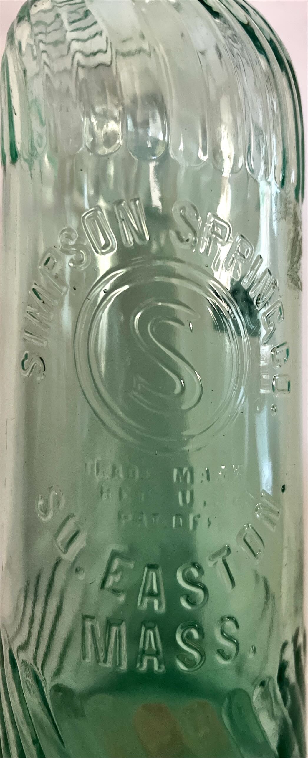 Home, Glassware, Bottle, Embossed Swirl Bottle from Simpson Spring Co. So. Easton, Mass., Simpson Spring Co., Front view
