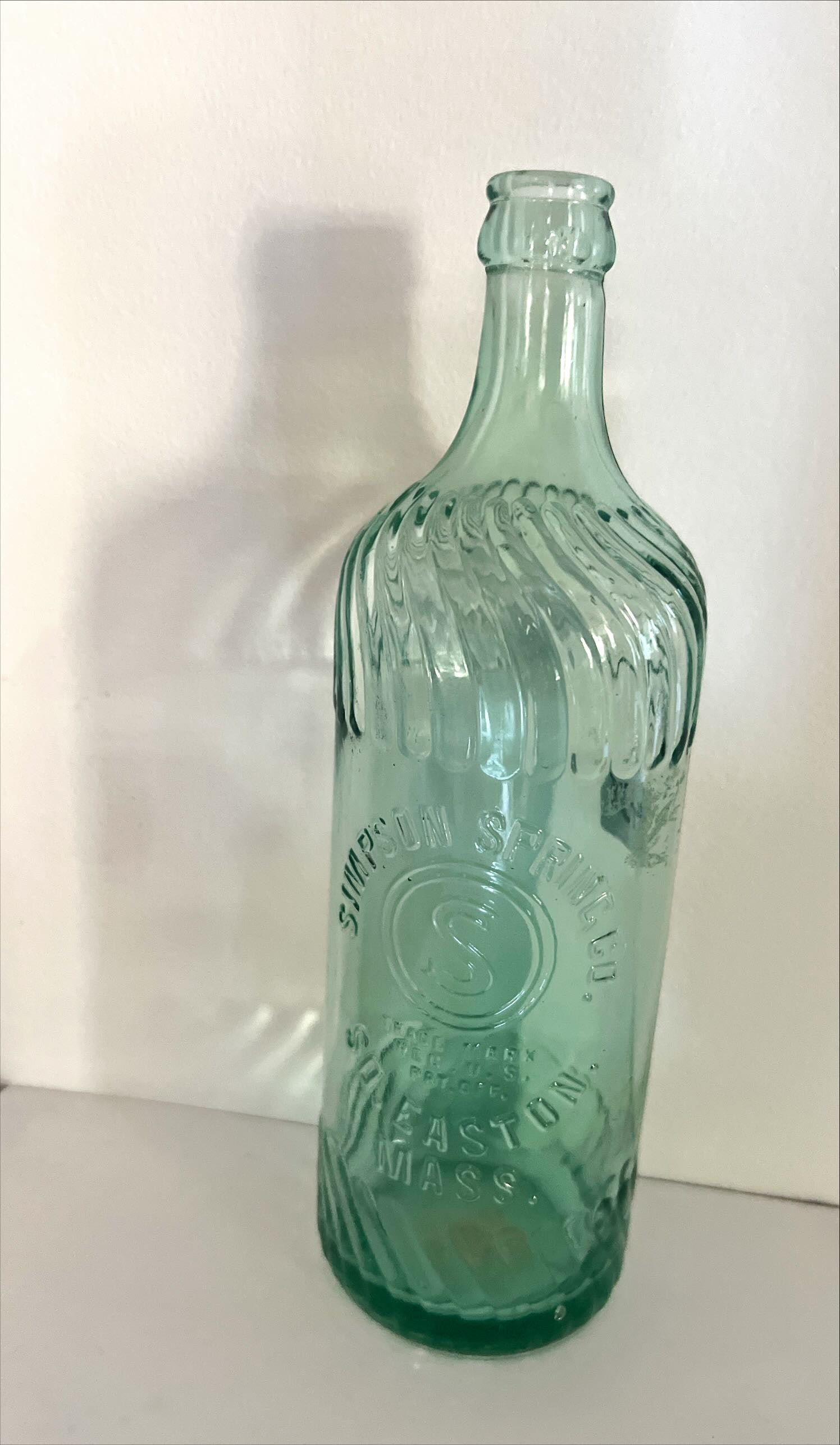 Home, Glassware, Bottle, Embossed Swirl Bottle from Simpson Spring Co. So. Easton, Mass., Simpson Spring Co., Front view